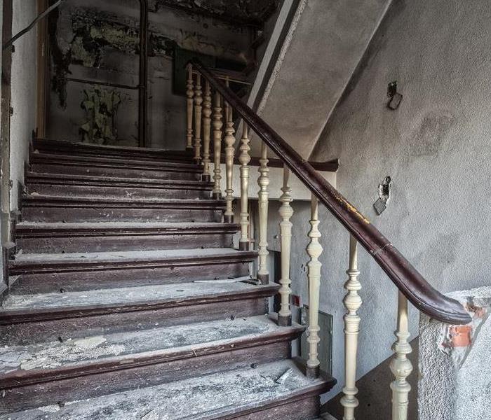 Fire damaged staircase in a multi-story old building.