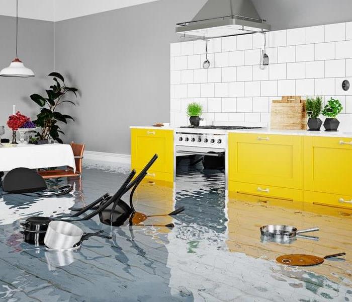 A high-end kitchen is under several inches of water after a flood.